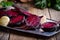 Sliced roasted beetroot on rustic outdoor party table