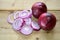 Sliced rustic red onions, vegetarian cooking ingredients