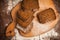 Sliced rye bread on cutting board closeup on table