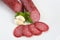 Sliced salami isolated with herb