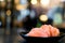 Sliced salmon sashimi on wooden table, Japanese food delicious menu, bokeh blurred background with copy space