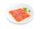 Sliced salted fillet of salmon on a white dish