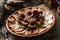 Sliced salted lard and bacon with rye bread, horseradish, spices on plate on rustic wooden background. Appetizer, close up