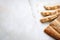 Sliced sesame bread on white concrete background. Top view, flat lay