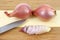 Sliced shallot on cutting board