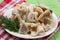 Sliced squid on a plate on a green wooden background