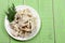 Sliced squid on a plate on a green wooden background