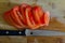 Sliced tomatoe and knife