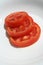 Sliced tomatoes. Tomato rings. Tomato slices. Fresh tomato sliced into rings.