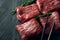 Sliced wagyu marbled beef for yakiniku on plate on black background, Premium Japanese meat