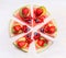 Sliced watermelon pizza with fruits and berries on white wooden background, top view. Healthy food