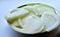 Sliced white onions on a white saucer in the kitchen