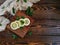 sliced and whole lemon on wooden chopping Board