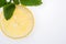 Sliced yellow lemon with leaves of fresh lemon balm Melissa officinalis