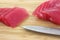 Sliced yellowfin tuna on cutting board