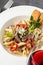 With sliced â€‹â€‹grilled meat on a creamy penne pasta
