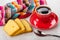 Slices of biscuit, coffee in cup on saucer, napkin, spoon