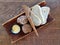 Slices of bread and butter on a wooden plate on a wooden serve table in a restaurant