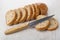 Slices of bread, kitchen knife on table