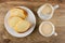 Slices of bread, pitcher and cup with fermented baked milk on wooden table. Top view