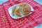 Slices of cornbread on white plate