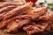 Slices of crispy hot fried bacon on a table
