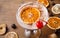 Slices of dried fruits on wooden board background