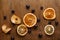 Slices of dried fruits on wooden board background