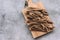 Slices of dried lingzhi mushroom, also called Reishi, on a wooden background