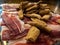 Slices of dried pork also known as Jamon Serrano with crusty bread toast Spanish