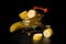 Slices of fresh, juicy banana lay in a metal decorative trolley. Great vegetarian food. Shot on a black background