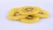 Slices of fresh juicy golden kiwi yellow kiwifruit rotating on white background. Isolated. Close-up macro.