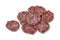 Slices of fresh Rosette de Lyon, a French pork saucisson on white background