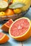 Slices of grapefruit, different fresh citrus fruit