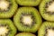 Slices of green kiwi face up.