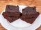 Slices of home made chocolate beetroot brownies on a plate