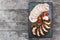 Slices of Homemade meatloaf, veal and pork tenderloin stuffed with vegetables on black slate stone chalkboard on wooden background