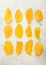 Slices of large sweet dried mangoes on light background.Top view