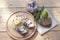 Slices of marinated mackerel with onion in a jar, lime, laurel and bread on wooden board