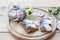 Slices of marinated mackerel with onion in a jar, lime, laurel and bread on wooden board