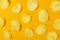 Slices of natural potato chips on cheerful orange background