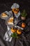 Slices of persimmon cheesecake on beautiful plates. dark background.