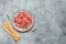 Slices of prosciutto di parma or jamon serrano in a plate and breadsticks on gray grunge background. Top view, flat lay