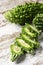 Slices of raw karela on a table