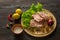 Slices of raw meat. Pork escalope on a wooden board.