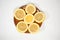 Slices of ripe juicy lemon full of vitamins lie on a clay saucer in the shape of a star, lemon on a white isolated background