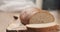 Slices of rye wheat rustic bread on cutting board