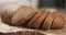 Slices of rye wheat rustic bread on cutting board