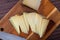 Slices of semi-hard spanish sheep cheese on desk