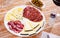 Slices of Spanish cheeses, salami and fuet sausage